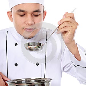 Male chef taste his cooking