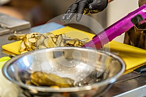 Male Cheff Slicing Pickled Cucumbers for Salads, Wedding Meal