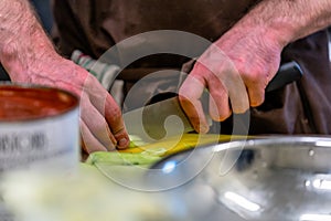 Male Cheff Slicing Pickled Cucumbers for Salads, Wedding Meal