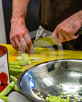 Male Cheff Slicing Pickled Cucumbers for Salads, Wedding Meal