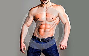 Male chest. Chest muscles. Muscled male torso with abs. Athletic Man showing muscular body and six pack abs. Gay poster