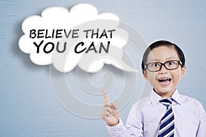Male child saying Believe That You Can