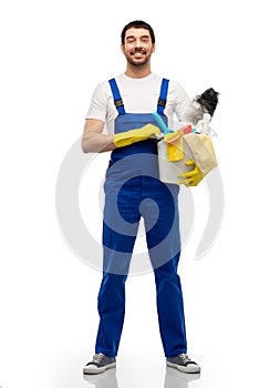 male cleaner in overal with cleaning supplies