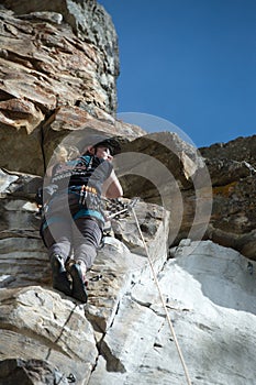 Male climber enjoying view from rock face