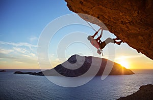 Male climber on overhanging rock photo
