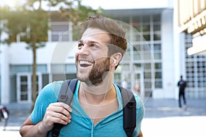 Male college student walking on campus