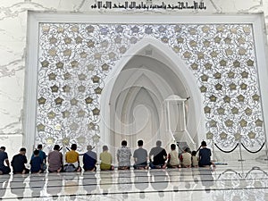 Male congregation praying inside the At-Thohir Mosque