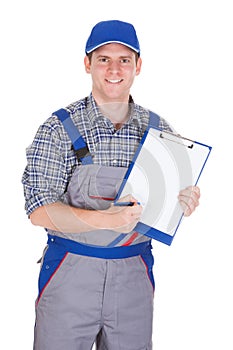 Male construction worker holding clipboard