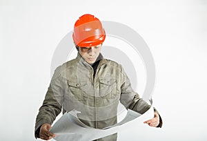 Male construction worker and sketching blueprints