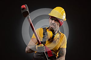 The male construction worker with a sledgehammer