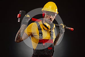 The male construction worker with a sledgehammer