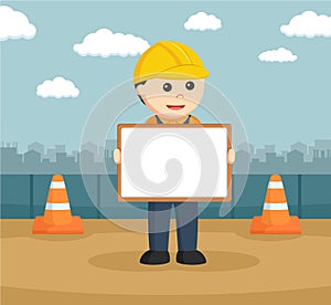 Male construction workers holding a empty board