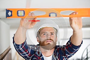 male contractor using spirit level