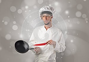 Male cook with shiny grey wallpaper