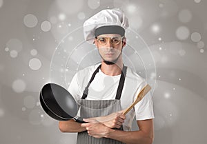 Male cook with shiny grey wallpaper