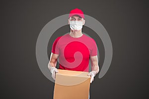 Male courier delivering package during pandemic