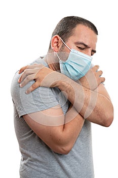 Male covering face having chills as high fever covid19 symptom photo