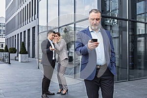 Male Coworkers employees man and woman Whispering Behind Back.