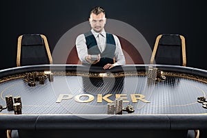 Male croupier at the poker table, poker room. Poker game, casino, Texas hold`em, online game, card games. Modern design, magazine