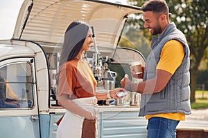 Male Customer Making Contactless Payment Using Smart Watch At Mobile Coffee Van