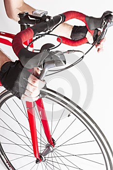 Male Cyclist Hands in Protective Gloves Put on Handlebars While Pressing Front and Rear Brakes Levers