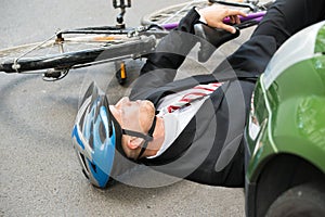 Male cyclist after road accident