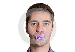 Male dad with baby nipple in mouth close-up head