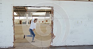 Male dancer in an empty warehouse