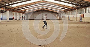 Male dancer in an empty warehouse