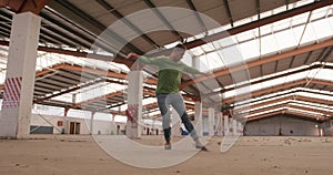 Male dancer in an empty warehouse