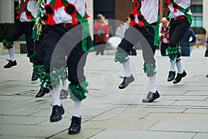 Male dancers dancing traditional English or Irish folk dance