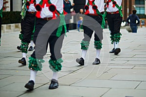 Male dancers dancing traditional English or Irish folk dance