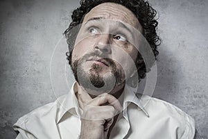 Male decisionmaking, man in white shirt with funny expressions