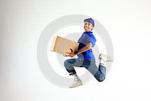 Male Delivery Courier Jumping with Cardboard Boax, Shipment Package Concept