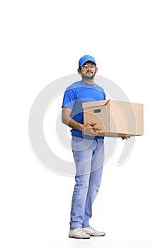 A male deliveryman, on a white background, full-length, with a box