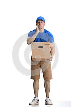 A male deliveryman, on a white background, full-length, with a box, tell a secret