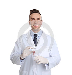 Male dentist holding tooth model
