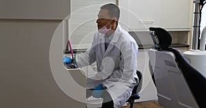 Male dentist using desktop pc 4k