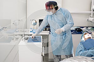 Male Dentist Working in Dental Clinic