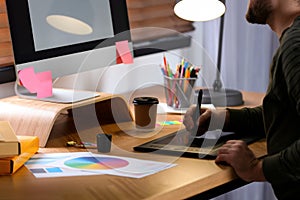 Male designer working at desk in office