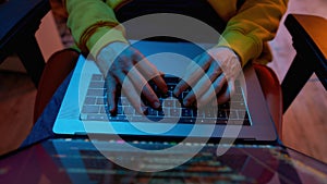 Male IT developer program code on laptop computer