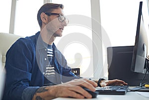 Male IT Developer Using Computer Side View