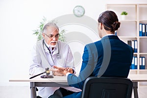 Male doctor in courthouse meeting with lawyer