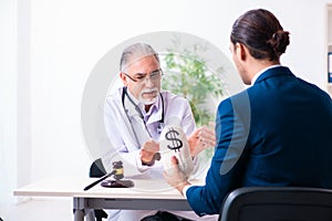 Male doctor in courthouse meeting with lawyer