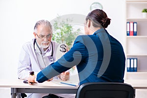 Male doctor in courthouse meeting with lawyer