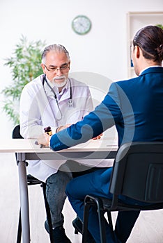 Male doctor in courthouse meeting with lawyer