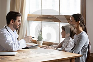 Male doctor examine little boy patient in hospital