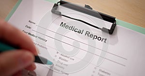 Male Doctor Filling Patient Information Form