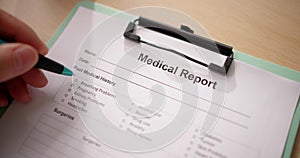 Male Doctor Filling Patient Information Form photo