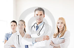 Male doctor in front of medical group